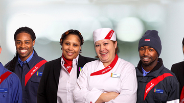 Sodexo employees in uniforms, posing for camera