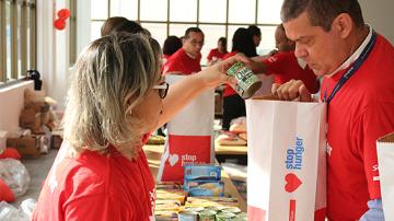 Stop Hunger volunteer, distributing food