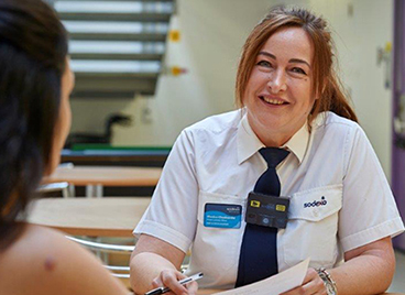 Female sodexo prison officer meeting a prisoner