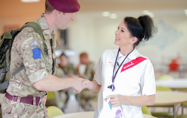 military man talking to a nurse