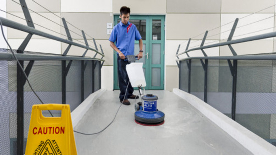 Sodexo employee cleaning a counter