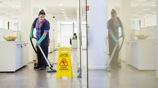 A sodexo employee cleaning a passage