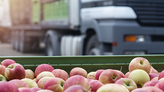Apples with truck in the background